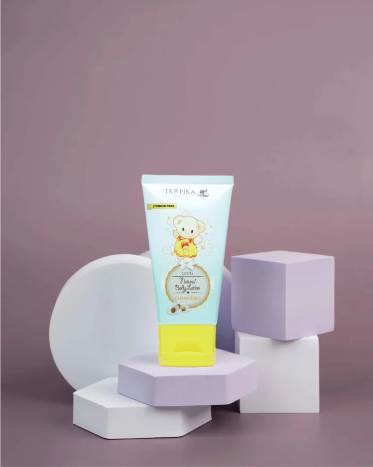 Tropika Natural Body Lotion, Chamomile, held in hand